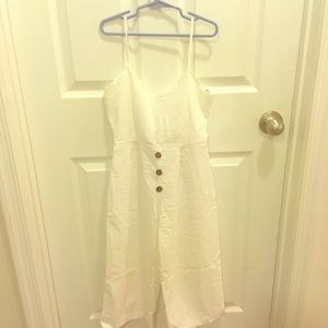 A girls white with button up front cami jumpsuit